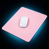 Pink mouse pad with a white mouse on a light gray surface