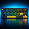 Mechanical keyboard with RGB lighting and a close-up of a key switch on a white background